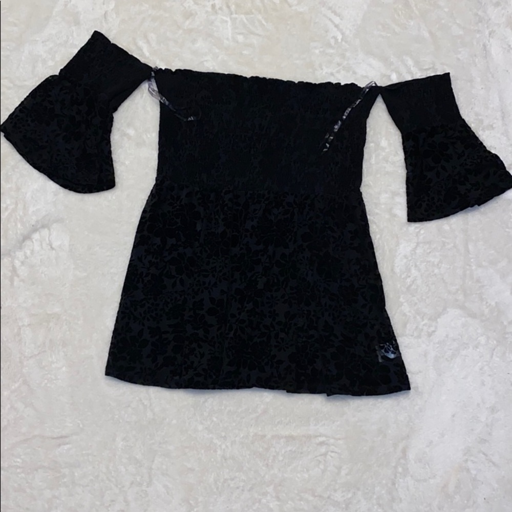 Francesca’s cold shoulder top with mesh belly area